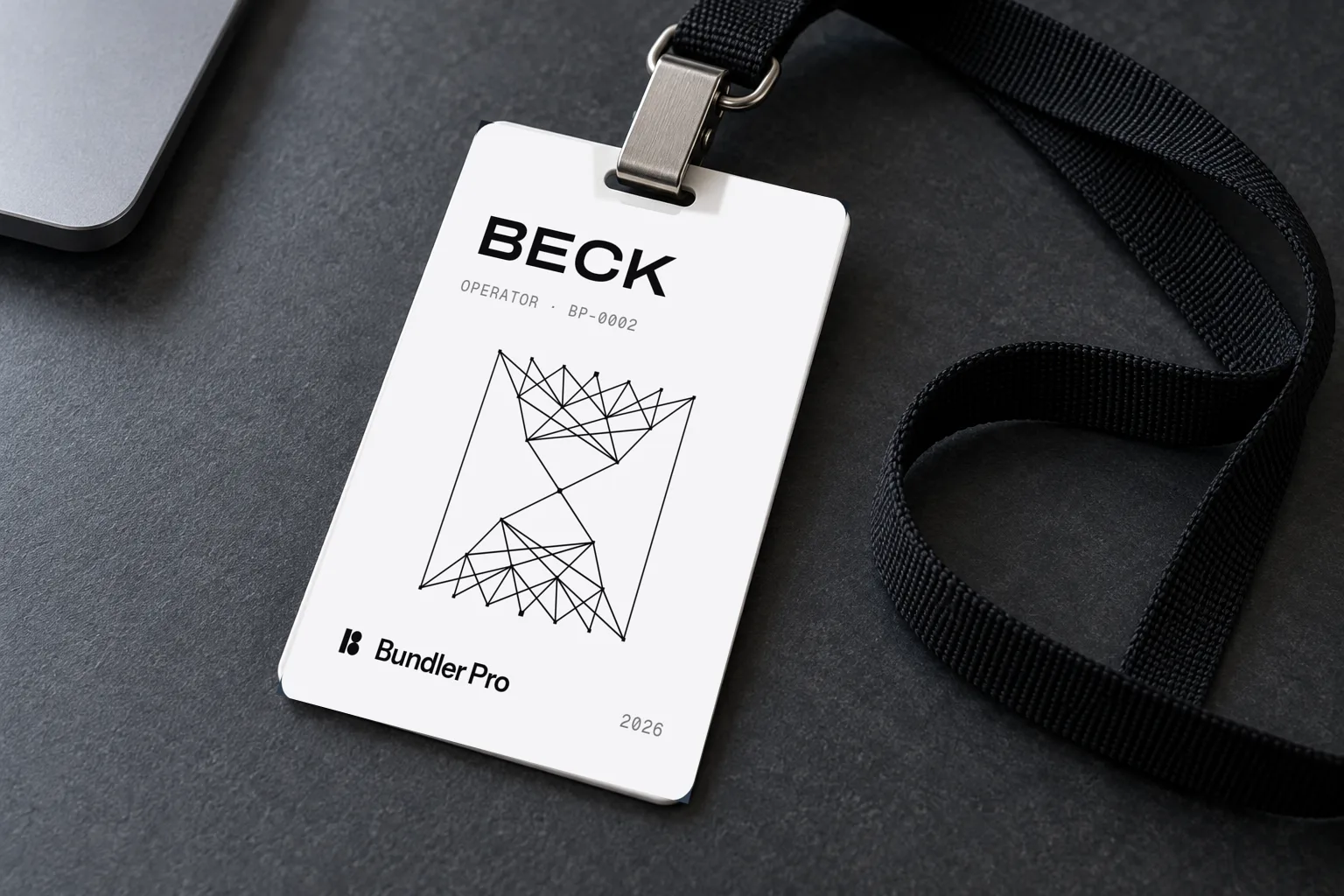 A Bundler Pro team badge for Beck on a desk